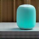 Image of a smart speaker gently emitting soothing light, representing voice-activated meditation.