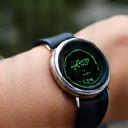 Image of a sleek wearable device on a wrist displaying heart rate data, symbolizing stress monitoring.